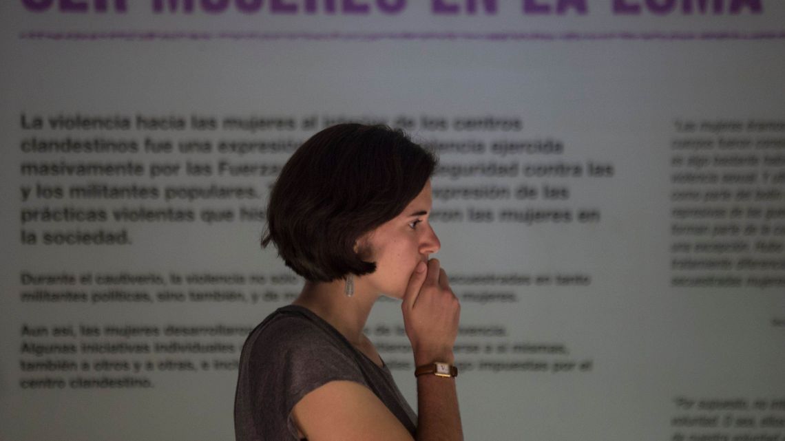 A woman attends the inauguration of an exhibit that recounts harrowing stories of dictatorship-era gender-based violence, at the former Naval Mechanics School, ESMA, once the era’s biggest clandestine detention and torture center.