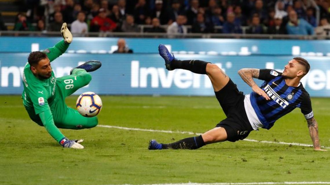 Mauro Icardi of Inter Milan, tries to score over AC Milan goalkeeper Gianluigi Donnarumma during the Serie A football match held on October 21, 2018, at the San Siro Stadium, in Milan, Italy. 