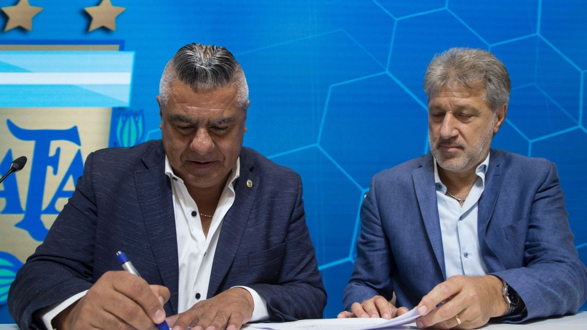 Claudio Tapia, president of Argentina's Soccer Federation, signs the contract to implement a plan to professionalize Argentine women's soccer in Buenos Aires on Saturday.