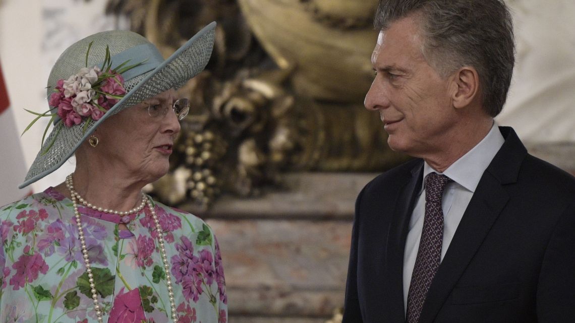 Queen Margrethe II of Denmark and Argentine President Mauricio Macri talk as they pose for pictures at the Casa Rosada in Buenos Aires on March 18, 2019.