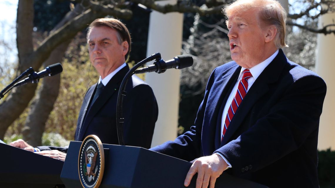 President Donald Trump and visiting Brazilian President Jair Bolsonaro speak during a news conference in the Rose Garden of the White House, Tuesday, March 19, 2019, in Washington. 