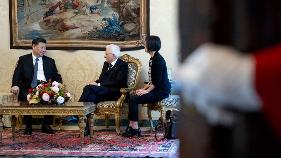 This photo taken on March 22, 2019, released by the Quirinale Presidential Press Office, shows Chinese President Xi Jinping (left) and Italy's President Sergio Mattarella (centre) with an interpreter, during their meeting at the Quirinale presidential palace in Rome, as part of Xi Jinping's two-day visit to Italy.