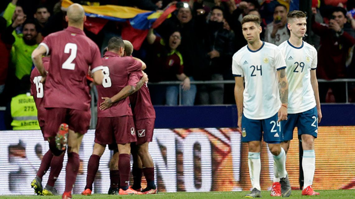 Venezuela's players, left, celebrated the third goal against Argentina during their international friendly football match at the Wanda Metropolitano stadium in Madrid, Spain, Friday, March 22, 2019.