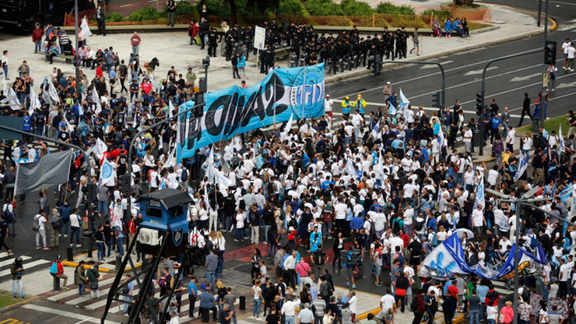 Union workers and social groups march during a protest against the economic policies of the government of President Mauricio Macri in Buenos Aires on April 4, 2019. 