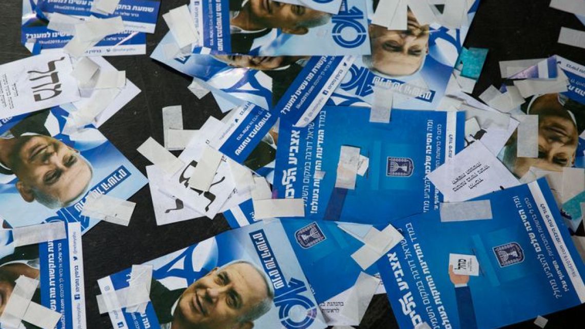 Likud party ballot papers and Israel’s Prime Minister Benjamin Netanyahu’s campaign fliers litter the ground as polls have officially closed for Israel’s general election on Wednesday, April 10, 2019, in Tel Aviv, Israel.