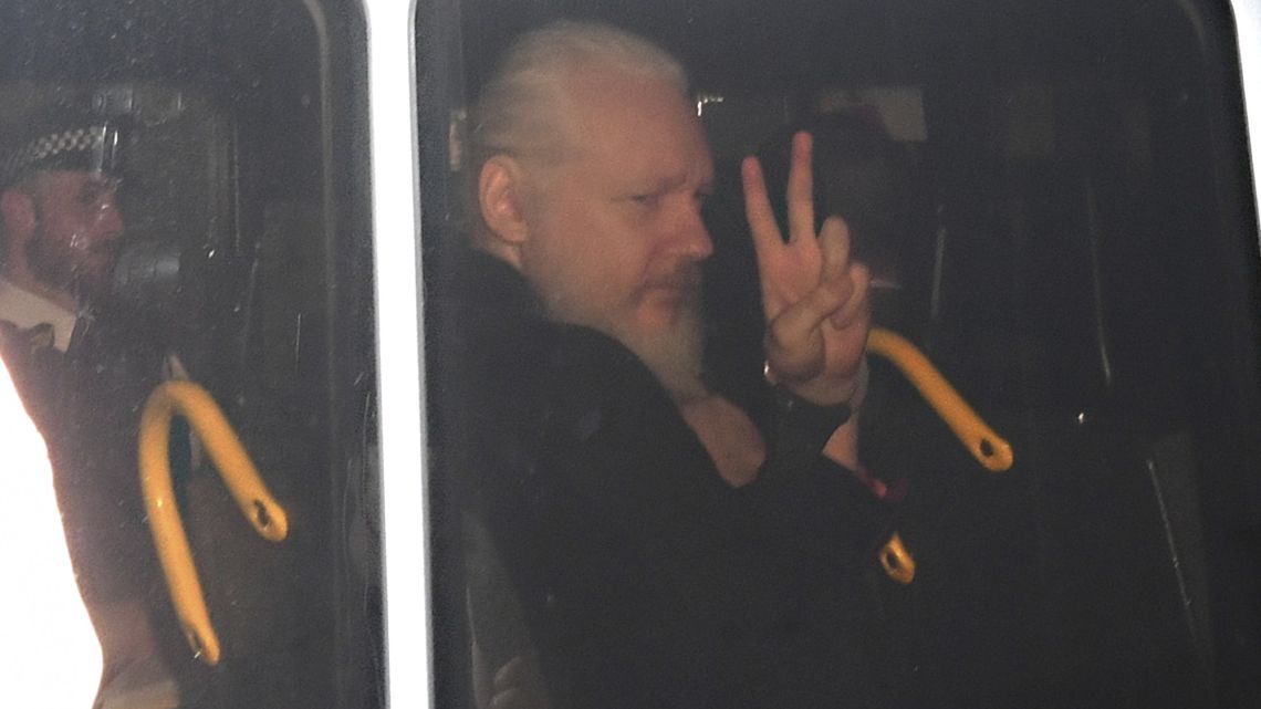Julian Assange gestures as he arrives at Westminster Magistrates’ Court in London on Thursday.