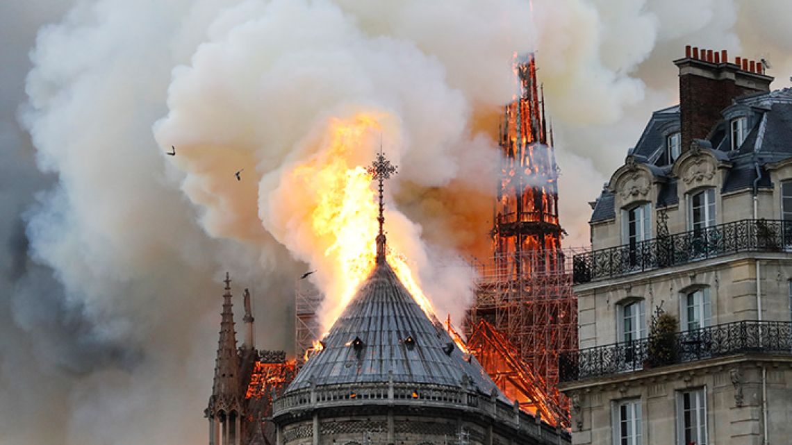 Smoke and flames rise during a fire at the landmark Notre-Dame Cathedral in central Paris on April 15, 2019, potentially involving renovation works being carried out at the site, the fire service said.  