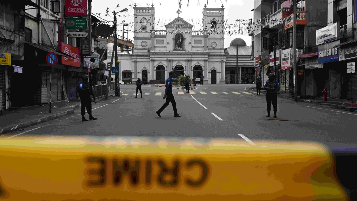 Security personnel stand guard in front of St. Anthony's Shrine in Colombo on April 23, 2019, two days after a series of bomb blasts targeting churches and luxury hotels in Sri Lanka. Sri Lanka began a day of national mourning on April 23 with three minutes of silence to honour more than 300 people killed in suicide bomb blasts that have been blamed on a local Islamist group.
