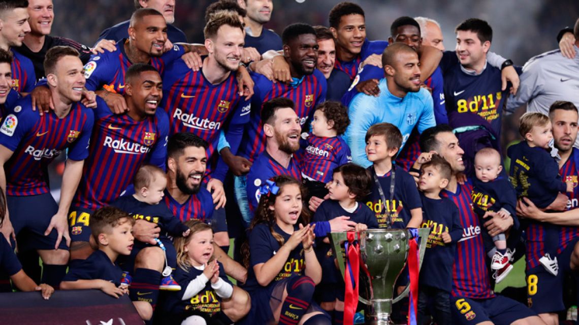 Barcelona's players celebrate winning the league title.