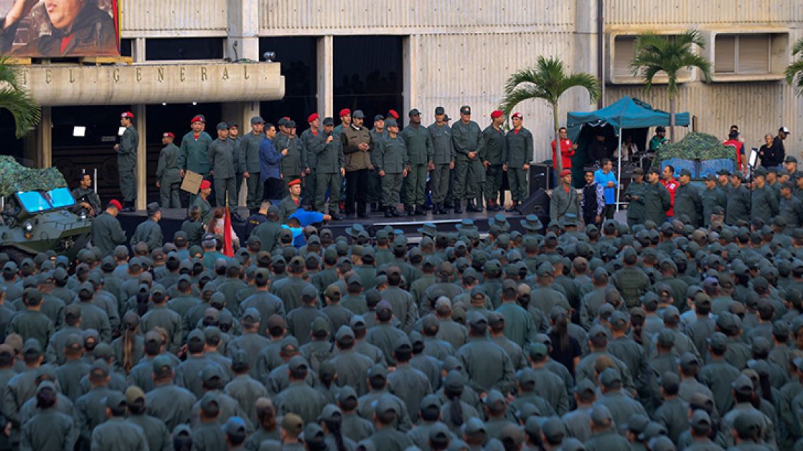 This handout picture released by Miraflores Palace press office shows Venezuela's President Nicolás Maduro delivering a message to loyal troops at the "Fuerte Tiuna" in Caracas, Venezuela on May 2, 2019. 