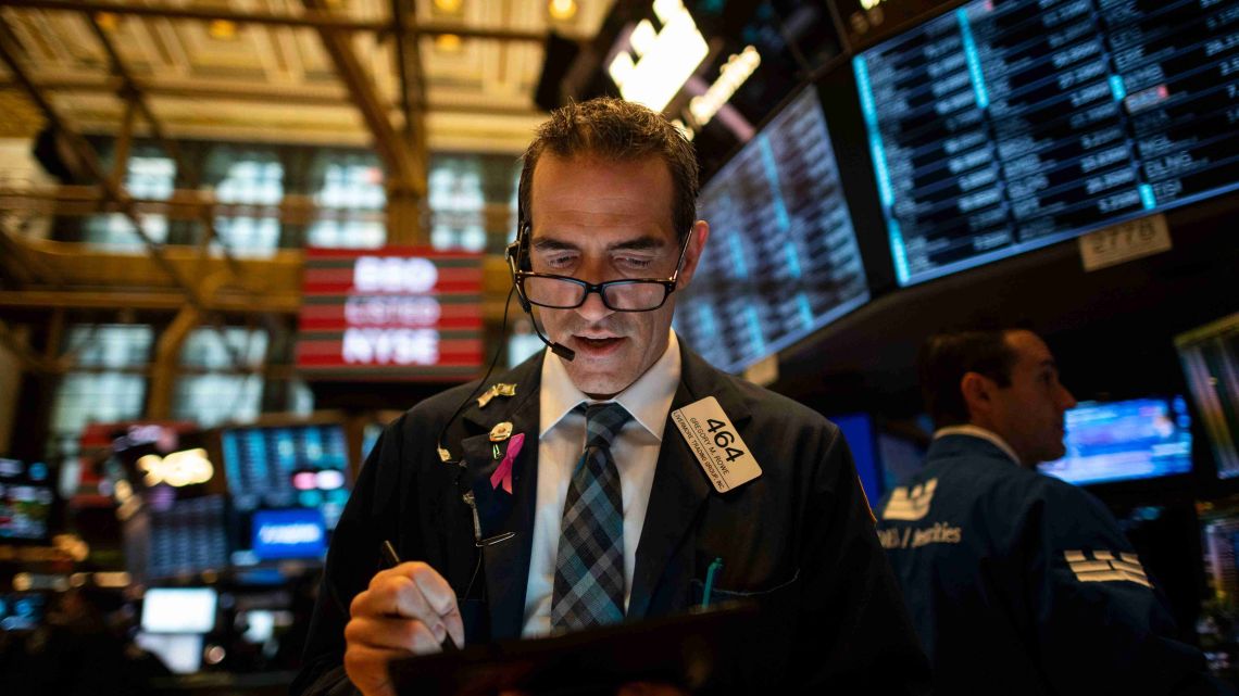 Traders work after the opening bell at the New York Stock Exchange (NYSE) on May 1, 2019 located at Wall Street in New York City. US firms hired at a blistering pace in April, the fastest in nine months, kicking off the second quarter of the year with a bang, according to a payroll data released Wednesday.