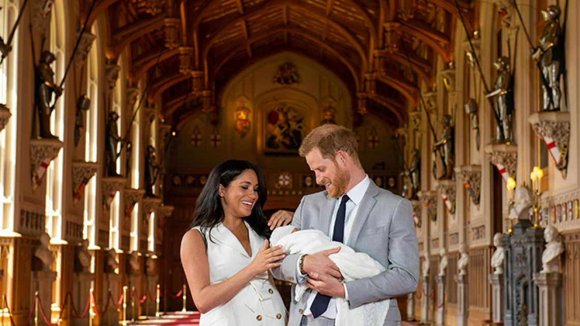 Britain's Prince Harry and Meghan, Duchess of Sussex, during a photocall with their newborn son, in St George's Hall at Windsor Castle, Windsor, south England, Wednesday May 8, 2019. Baby Sussex was born Monday at 5:26 a.m. (0426 GMT; 12:26 a.m. EDT) at an as-yet-undisclosed location. An overjoyed Harry said he and Meghan are "thinking" about names. 