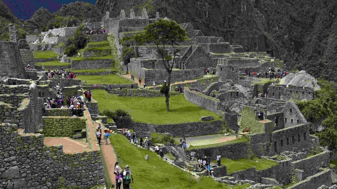 View of the Machu Picchu complex, the Inca fortress enclaved in the south eastern Andes of Peru taken on December 30, 2014. Peru announced on Friday a two-week restriction to three important areas at Machu Picchu to prevent greater degradation to the iconic Inca citadel.