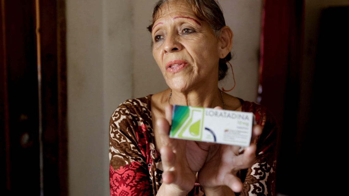 Bertha Dun shows medicine bought with cryptocurrency through online transfers, in Barquisimeto, Venezuela, Thursday, April 11, 2019. Venezuela's political and economic crisis has now made it a prime testing ground using cryptocurrency to finance social projects or send relief directly to people living in poverty.