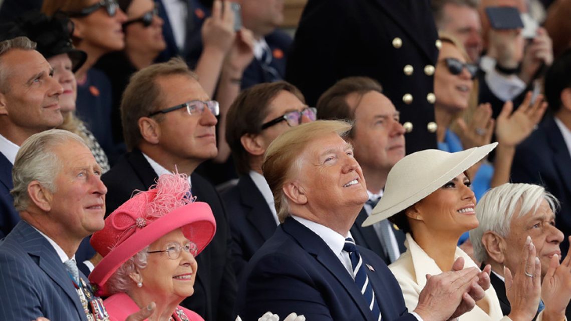 Britain's Prince Charles, Queen Elizabeth II, US President Donald Trump, First Lady Melania Trump and Greek President Prokopis Pavlopoulos, from left, applaud as they watch a fly past at the end of an event to mark the 75th anniversary of D-Day in Portsmouth, England Wednesday, June 5, 2019. World leaders including U.S. President Donald Trump are gathering Wednesday on the south coast of England to mark the 75th anniversary of the D-Day landings.