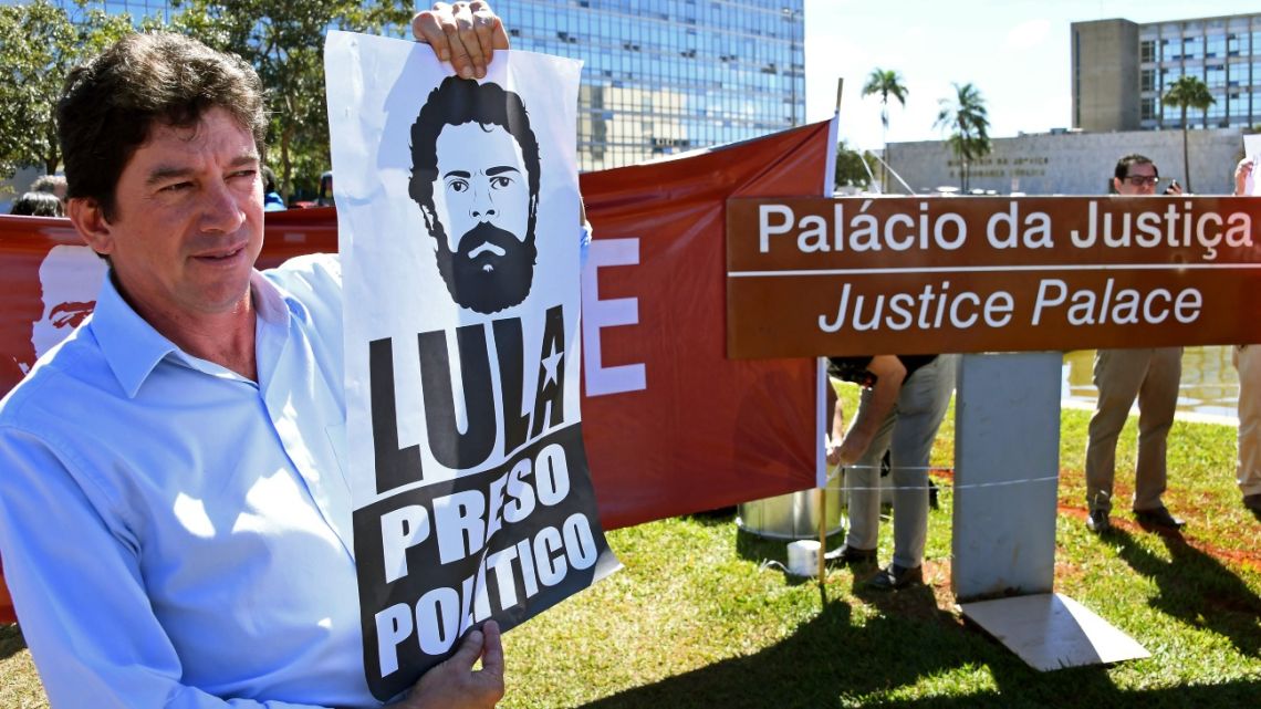 Demonstrators protest in front of the Justice Ministry in Brasilia calling for the release of former President Luiz Inacio Lula da Silva
