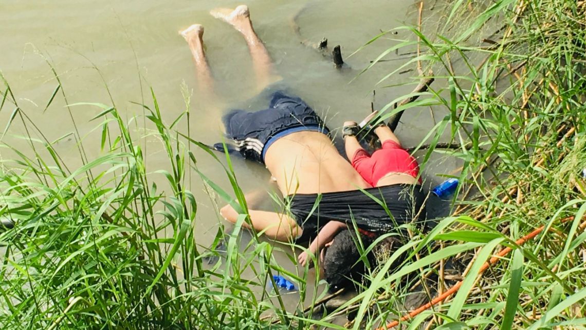 The bodies of Salvadoran migrant Oscar Alberto Martínez Ramírez and his nearly 2-year-old daughter Valeria lie on the bank of the Rio Grande in Matamoros, Mexico, Monday, June 24, 2019.