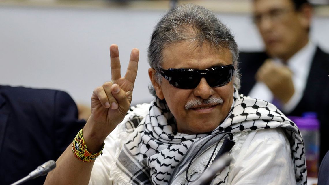 Former FARC rebel Jesus Santrich flashes victory sign in Colombian Chamber of Representatives
