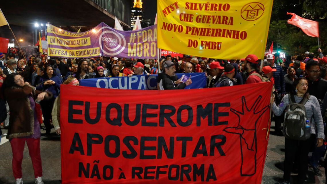 Demonstrators hold banner saying "I want to retire, no to the pension reforms", during a protest against the pension reforms in Sao Paulo, Brazil, 