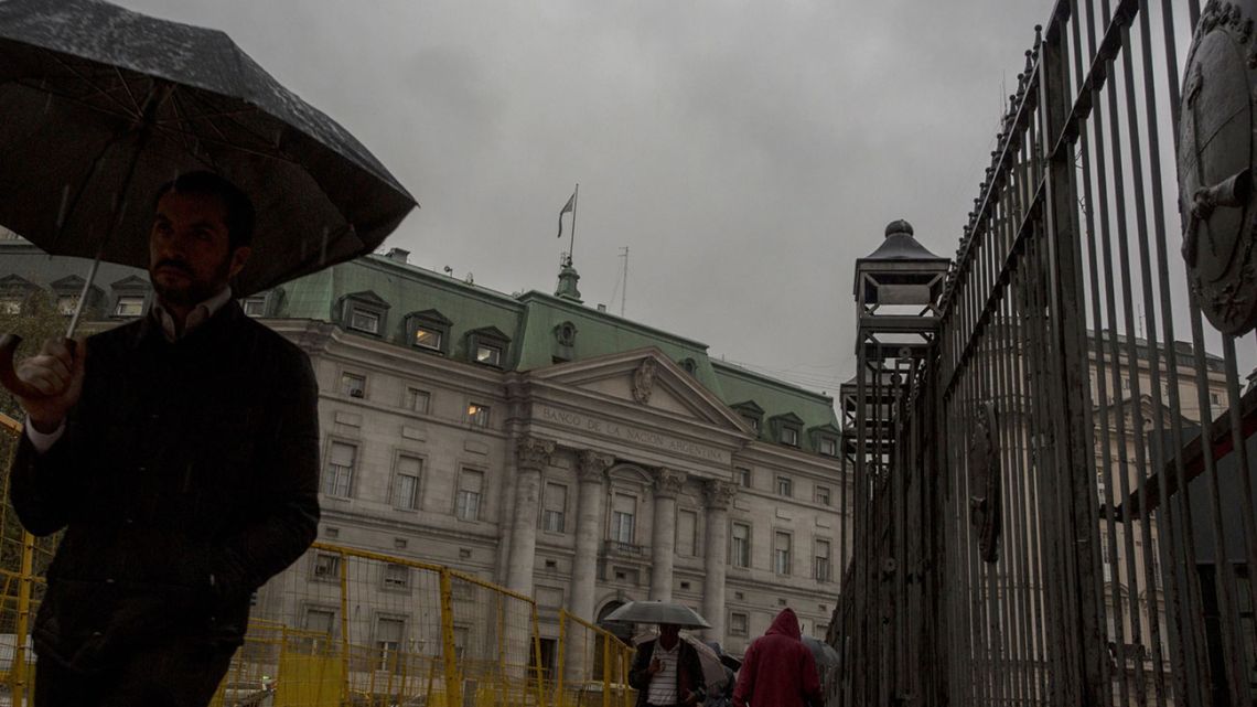 Grey clouds loom over the Plaza de Mayo and Casa Rosada.