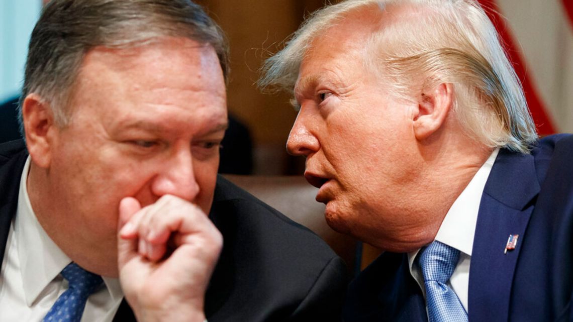 US Pres. Donald Trump turns to Sec. of State Mike Pompeo at the White House