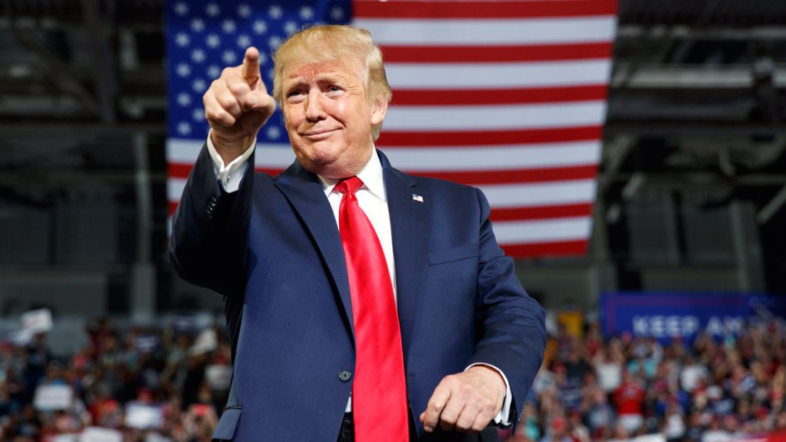 US President Donald Trump poses for the crowd at a campaign rally in Greenville, North Carolina on Wednesday, July 17, 2019. 