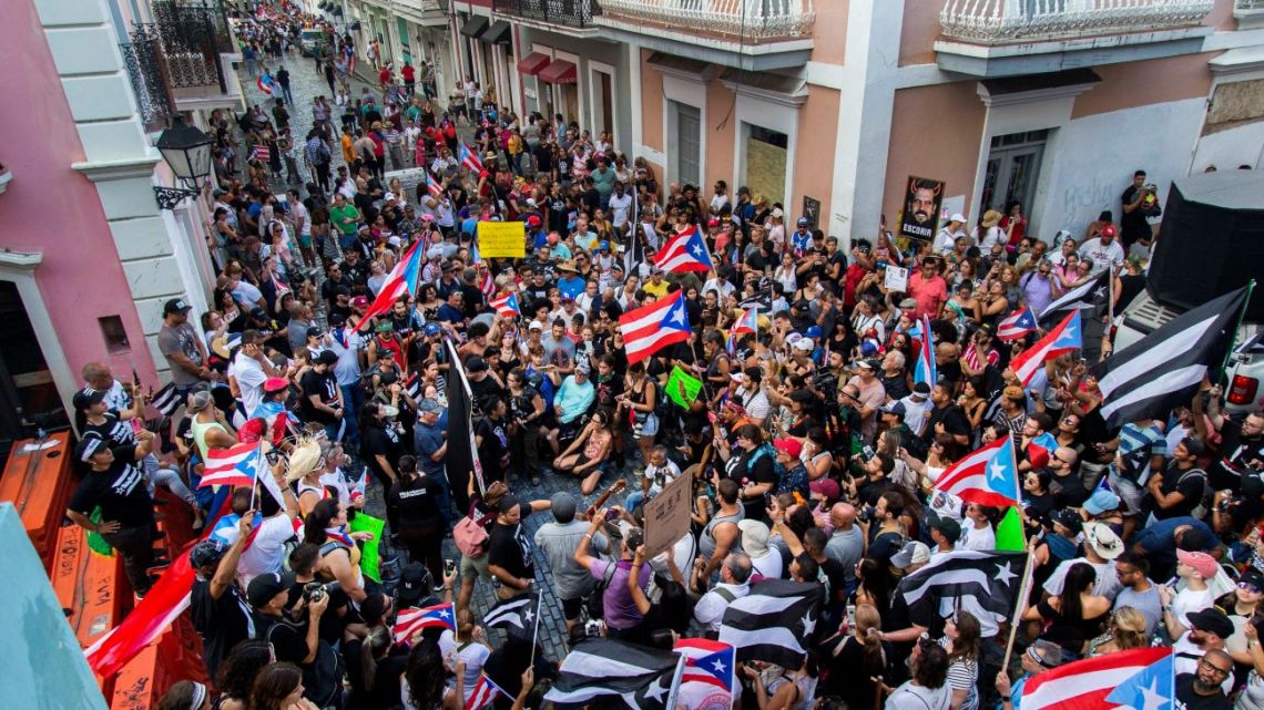 Demonstrators protest against Gov. Ricardo Rossello in San Juan, Puerto Rico, Sunday, July 21, 2019. 