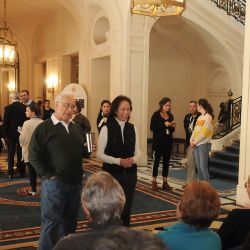US Ambassador to Argentina Edward Prado talks to guests, as they enjoy a tour of Palacio Bosch. 