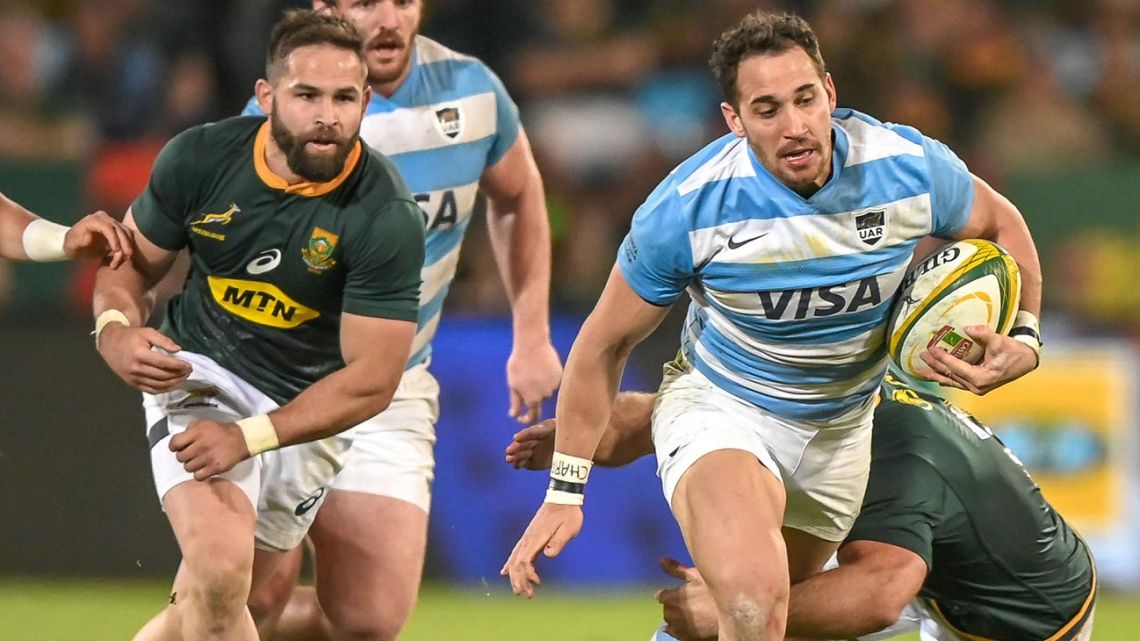Argentina center Joaquín Tuculet (centre) is tackled by South Africa Captain and hooker Schalk Brits (behind) during the 2019 Rugby Union World Cup warm-up test match between South Africa and Argentina at the Loftus Versfeld Stadium in Pretoria, on August 17, 2019.  
