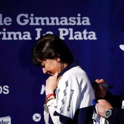 Diego Maradona signs the Gimnasia shirt of Giselle Fernández, the sister of former president Cristina Fernández de Kirchner.