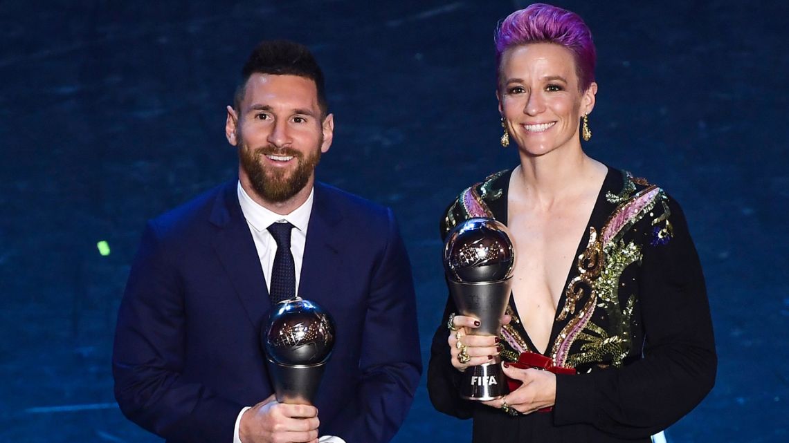 Lionel Messi poses with Megan Rapinoe after they received the Best FIFA Men's and Women's player awards, during an award ceremony at Milan's La Scala theatre.