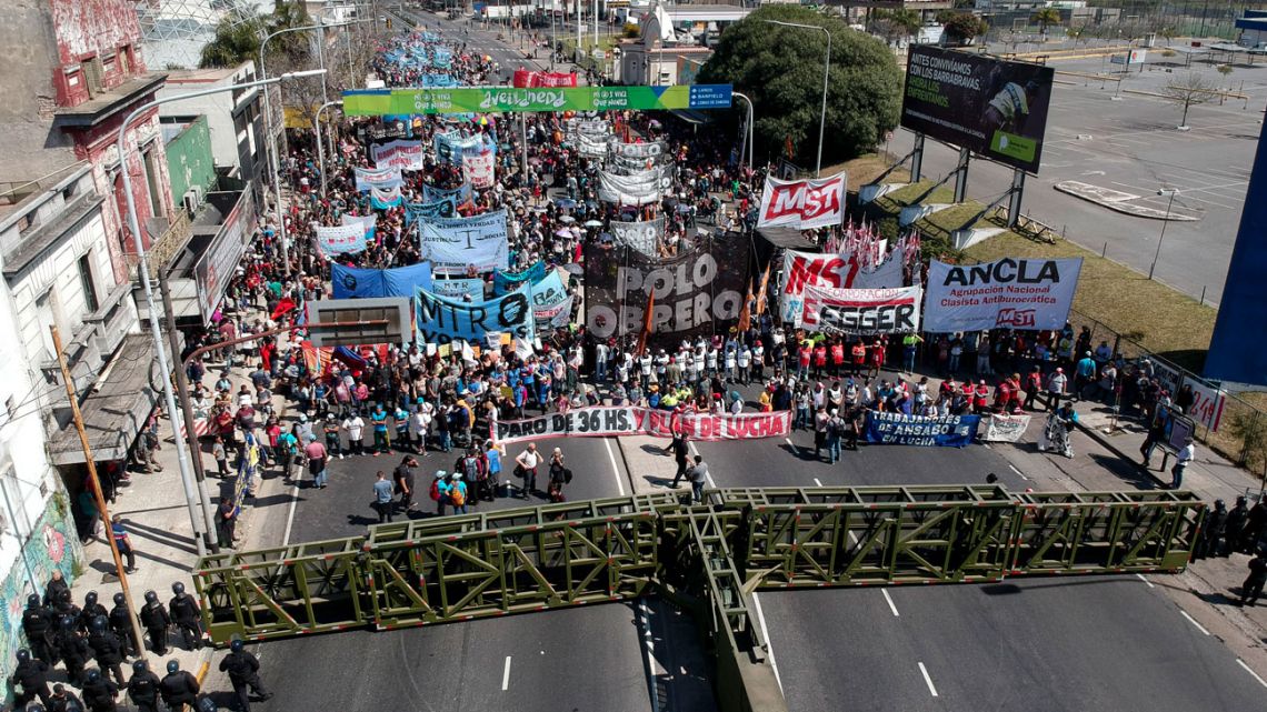 Social organisations and political groups protest against the government's economic policies on the outskirts of Buenos Aires on Tuesday.