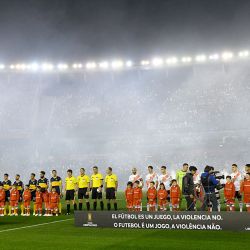 Players from Boca Juniors and River Plate line up prior to their Copa Libertadores semi-final first leg.
