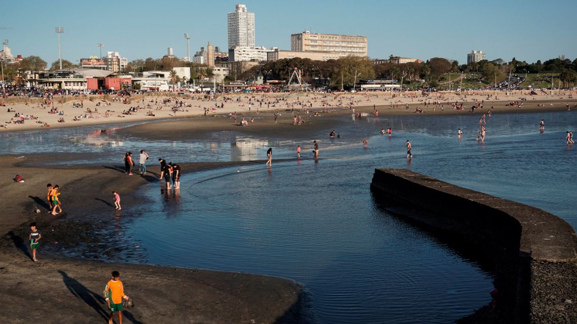 People enjoy Ramírez beach in Montevideo. 