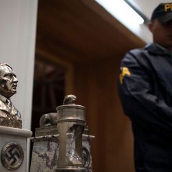 Argentine authorities found the cache of Nazi artifacts in a secret room behind a bookcase, and said that they had uncovered the collection in the course of a wider investigation into artwork of suspicious origin found at a gallery in Buenos Aires.