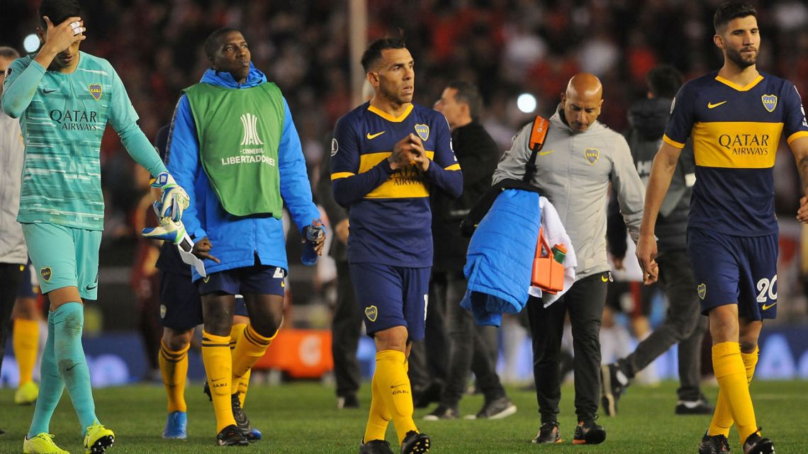 Boca Juniors players leave the field after their 0-2 loss against River Plate at the Monumental on Tuesday.