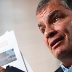 Former Ecuador President Rafael Correa talks during an interview with Associated Press in Brussels, Correa dismisses as "nonsense" allegations that he is plotting with Venezuela President Nicolas Maduro to destabilize the current Ecuador government amid violent unrest.