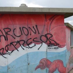 Street graffiti calls Provincial Governor Mariano Arcioni an 