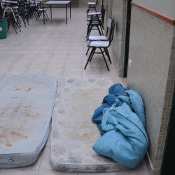 Beds used by students in the halls of Escuela 712, a high school occupied by students for over a month in Trelew.