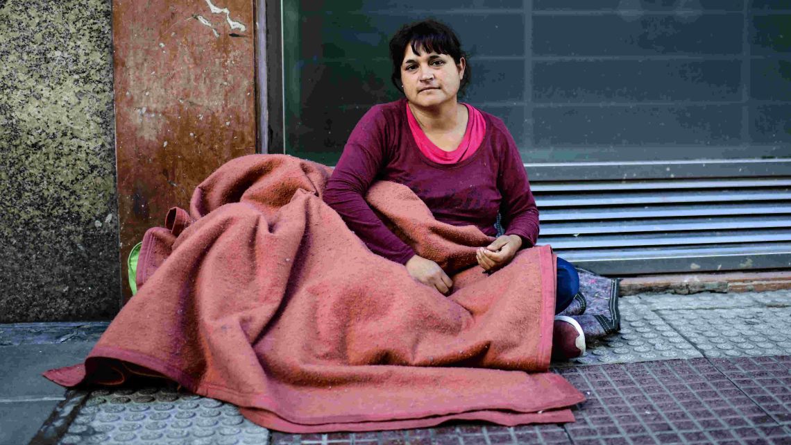 Patricia Sánchez poses for a picture on a street in Buenos Aires, on October 18, 2019. Squares, train stations, public hospitals, and street corners have become increasingly populated with an influx of homeless Argentines during the country's worst economic crisis in 18 years.