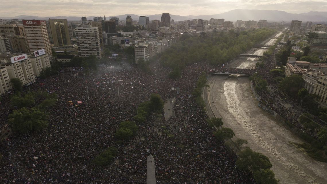 People gather during an anti-government protest in Santiago, Chile.