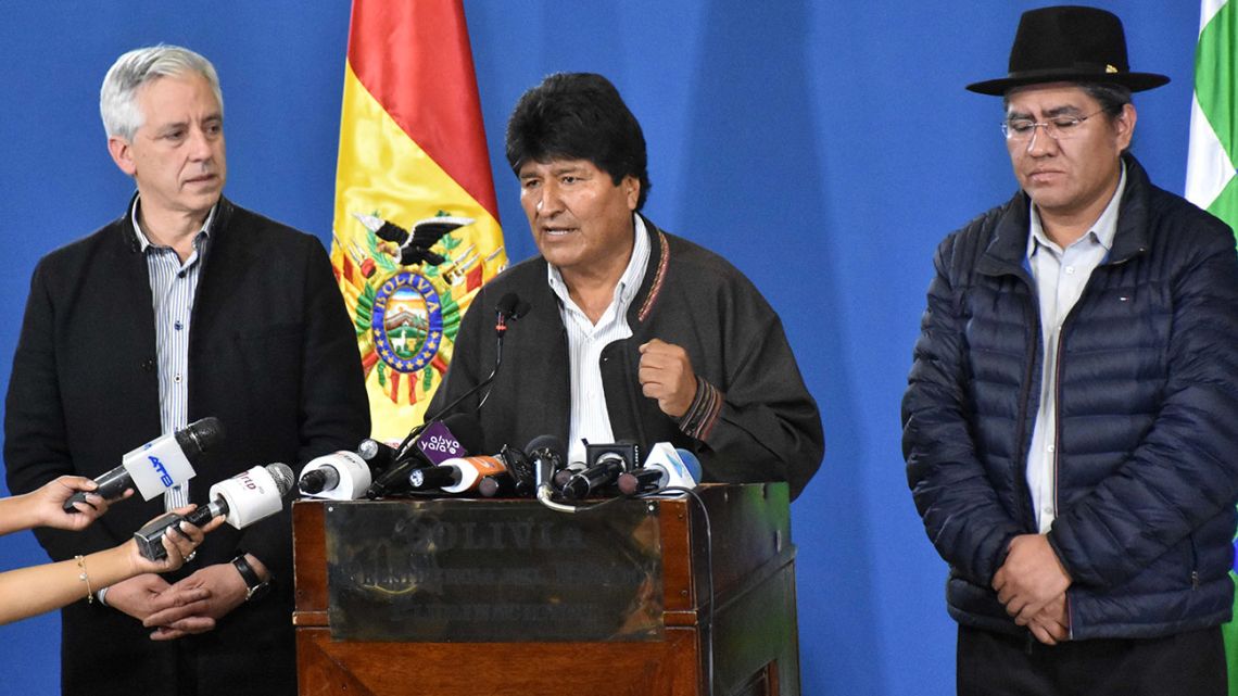 Handout photo released by the Bolivian Presidency of President Evo Morales speaking during a press conference next to his Vice-President Alvaro García Linera (left) and his Foreign Minister Diego Pary in El Alto.