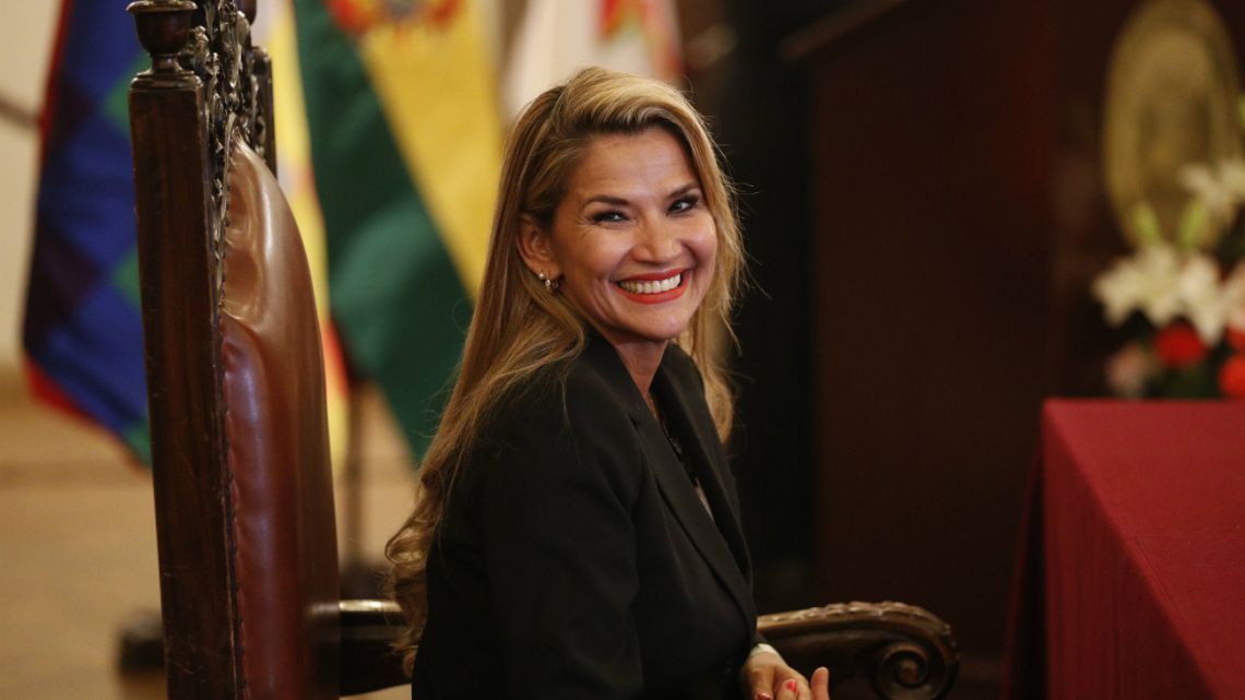 The opposition senator who has claimed Bolivia's presidency Jeanine Anez smiles during the swearing-in ceremony of her new cabinet at the presidential palace in La Paz, Bolivia