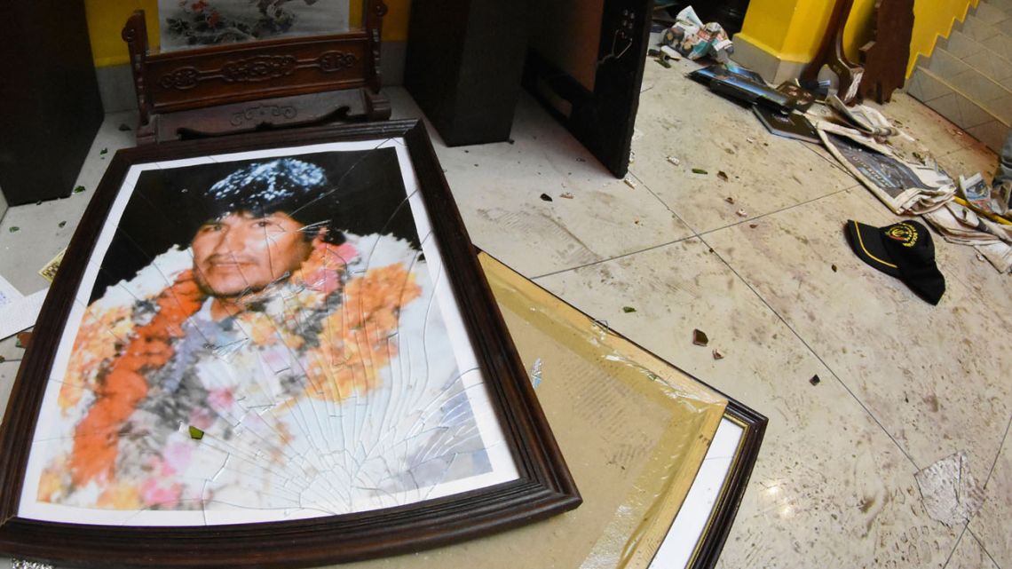 A smashed portrait of Evo Morales is pictured on the floor of his private home in Cochabamba, after hooded opponents broke into the residence last Sunday.