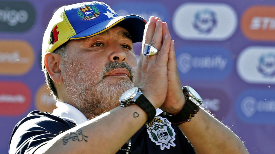 In this file photo taken November 2, 2019, Gimnasia y Esgrima coach Diego Armando Maradona gestures to supporters.