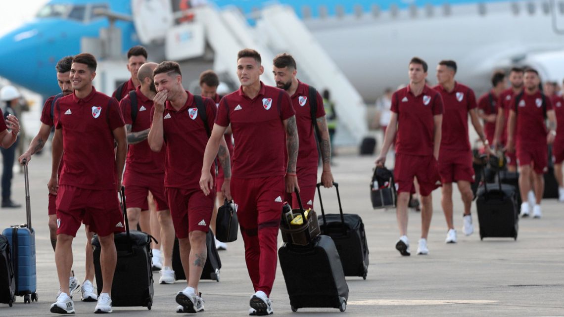 The River Plate squad walks on the tarmac after arriving to the military airport Grupo Aereo 8, in Lima, Peru, Wednesday, November 20, 2019.