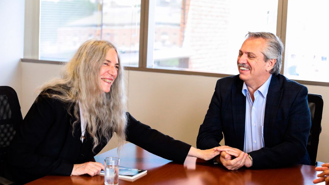 Handout photo released by the press office of Argentina's President-elect Alberto Fernández (right) shows him with musician Patti Smith, during a meeting in Buenos Aires on November 22, 2019. 