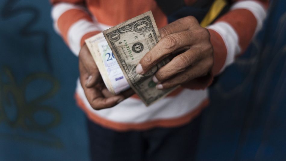 The Once-Forbidden U.S. Dollar Is Suddenly Everywhere In Venezuela