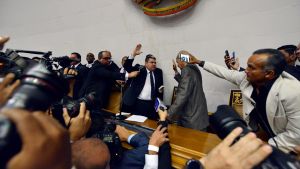 Lawmaker Luis Parra is sworn-in as National Assembly president after opposition lawmakers were blocked by police from entering the session.