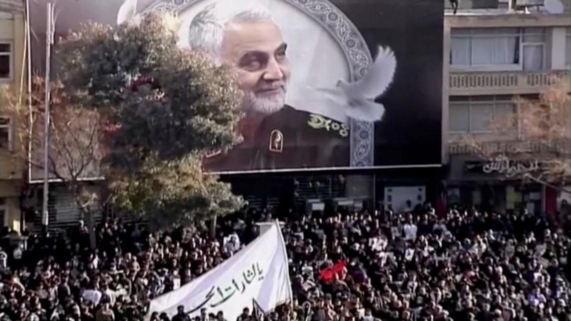 In this image made from a video, mourners gather to pay their respects to the slain Gen. Qassem Soleimani who was killed in a U.S. airstrike, in Kerman, Iran Tuesday, Jan. 7, 2020.